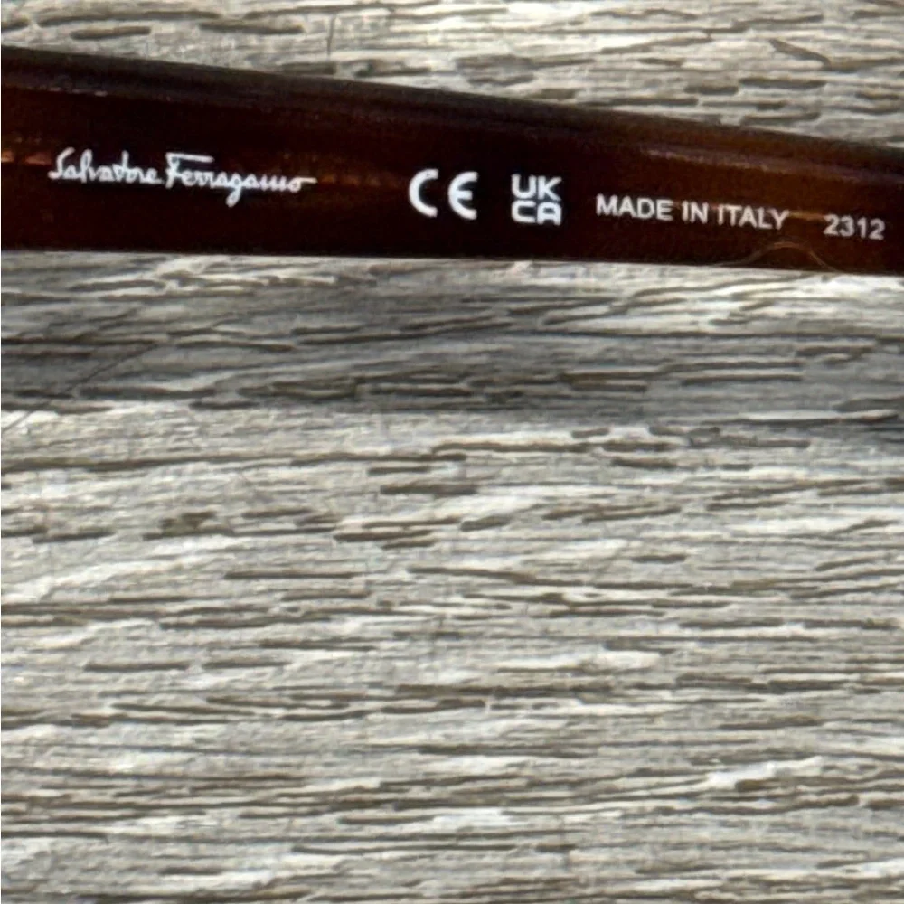 Salvatore Ferragamo Tortoise Sunglasses with SF Logo at Temples.